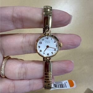 Bulova Women's Gold and White stretchy bracelet Watch